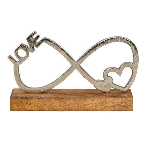Metal infinity symbol sculpture with wooden base, 14.5x24cm